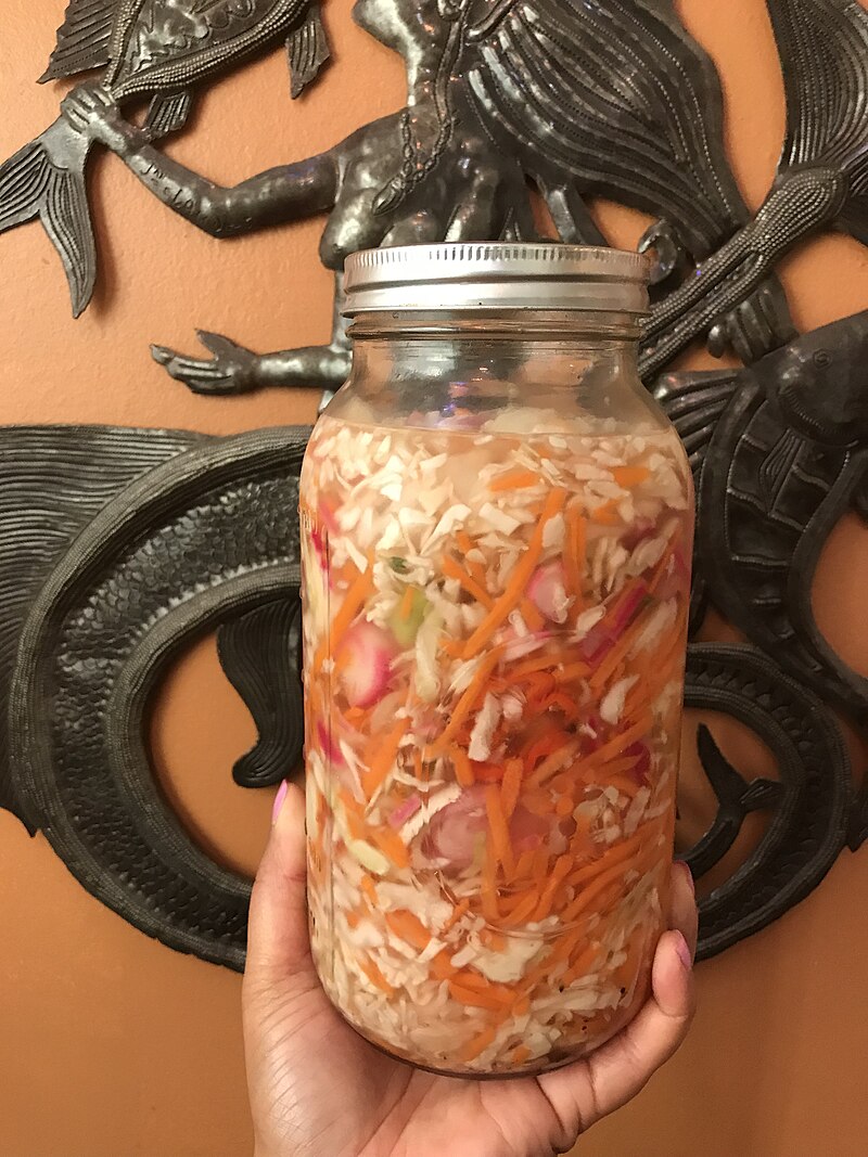 A jar of Haitian pikliz — spicy pickled vegetable condiment essential to Haitian cuisine