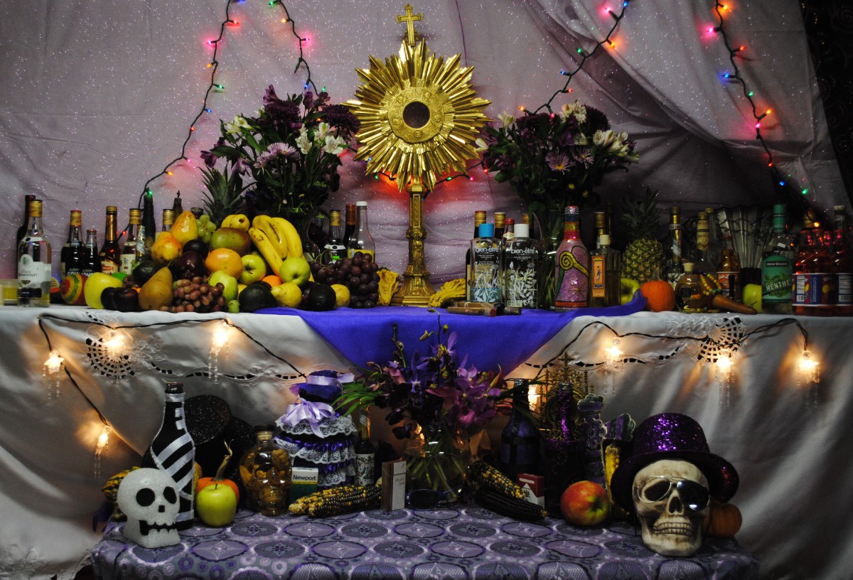 A Haitian Vodou altar dedicated to the Petwo, Rada, and Gede spirits, adorned with offerings, candles, and sacred objects